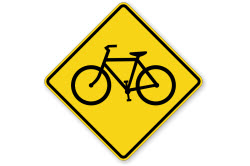 A bicycle crossing sign on a white background