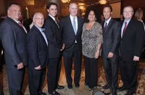 Douglas Sheff (second from right) attends a 2011 MBA reception at the Ritz in Boston